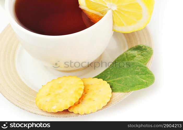 cup of tea with lemon, pastry and sugar