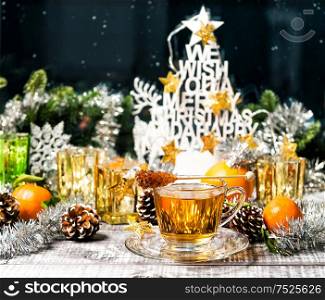Cup of tea with window decoration. Christmas ornaments. Winter food and drinks