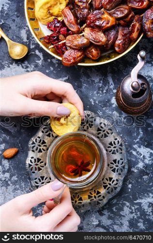 Cup of Turkish tea. Still life with a cup of oriental tea and fig fruits