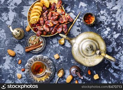 Cup of Turkish tea. Still life with a cup of oriental tea and fig fruits