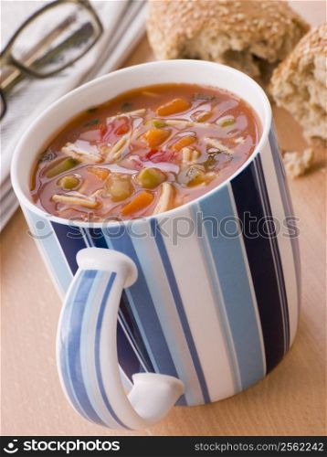 Cup Of Vegetable And Pasta Soup With A Granary Bread Roll