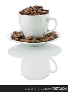 cup on the suaser with coffee beans