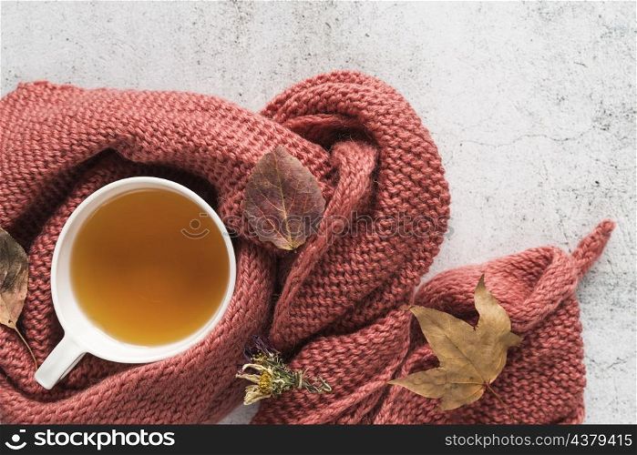 cup with beverage knitwear leaves