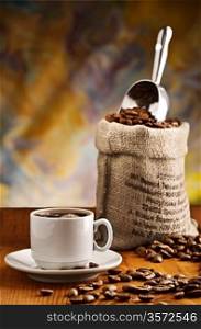 cup with coffee and sack