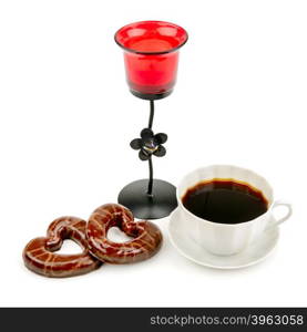 cup with coffee, biscuits and a candlestick isolated on a white background