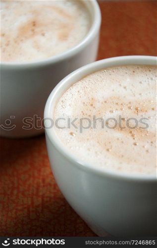 Cup with frothed cappuccino. Coffee drink in cups.