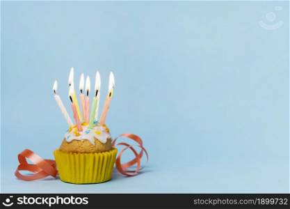 cupcake with many lit candles copy space. Resolution and high quality beautiful photo. cupcake with many lit candles copy space. High quality beautiful photo concept