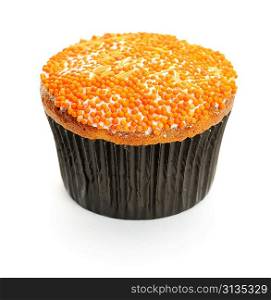 Cupcake with orange icing isolated on white