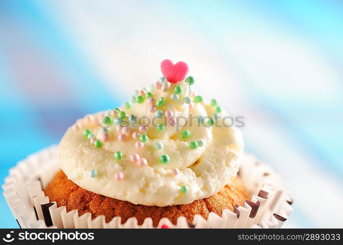 Cupcake with whipped cream and icing