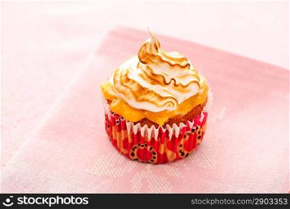 Cupcake with whipped cream and icing