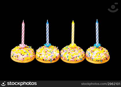 Cupcakes and candles isolated on the white background