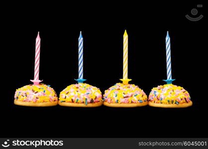 Cupcakes and candles isolated on the white background