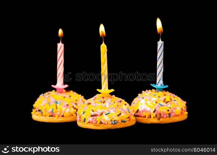 Cupcakes and candles isolated on the white background