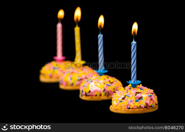 Cupcakes and candles isolated on the white background