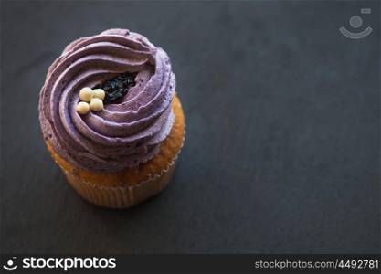 Cupcakes desert cream. Cupcakes desert cream with space for text on a stone background