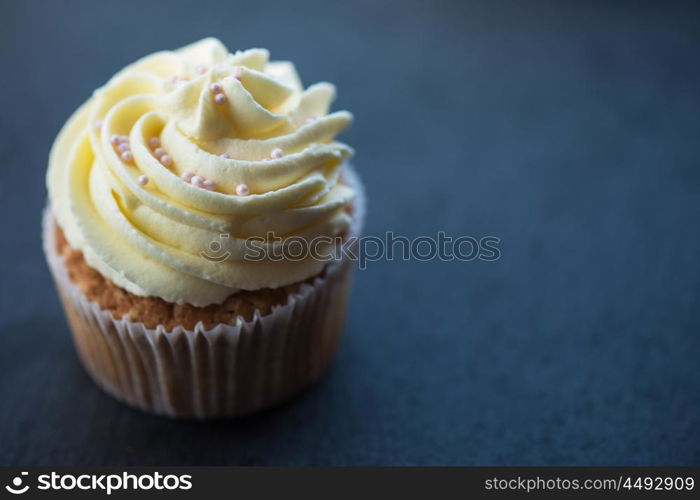 Cupcakes desert cream. Cupcakes desert cream with space for text on a stone background