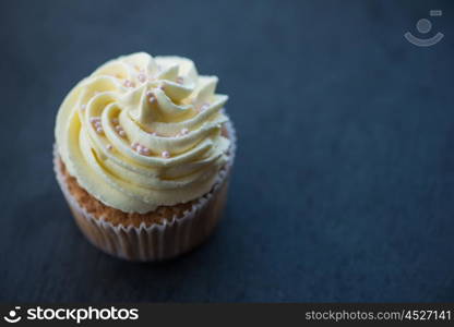 Cupcakes desert cream. Cupcakes desert cream with space for text on a stone background