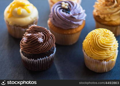 Cupcakes desert cream on a stone background. Cupcakes desert cream