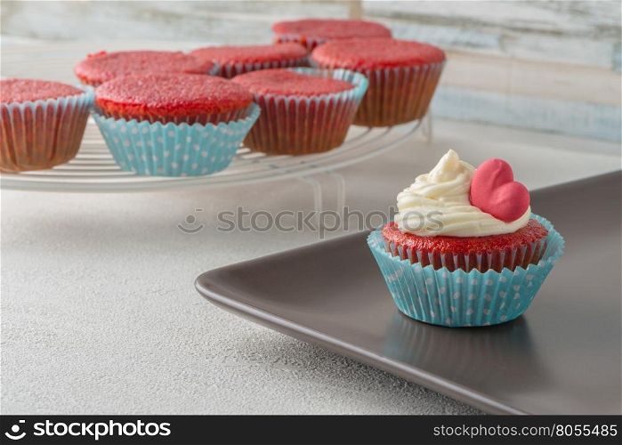 Cupcakes with red heart close up.
