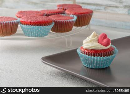 Cupcakes with red heart close up.