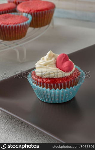 Cupcakes with red heart close up.