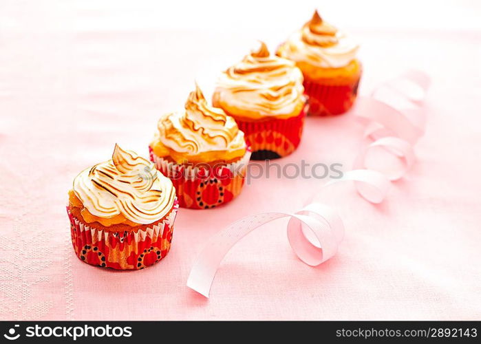 Cupcakes with whipped cream and icing