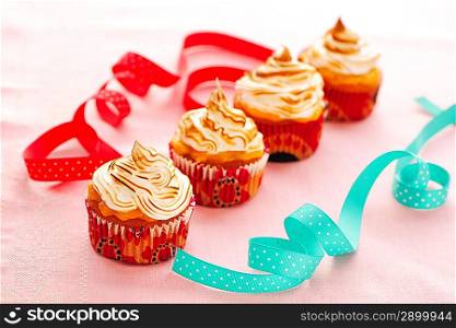 Cupcakes with whipped cream and icing