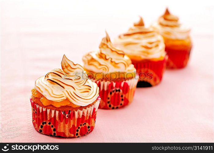 Cupcakes with whipped cream and icing