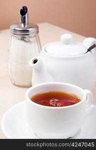 cups of tea with a teapot .close up