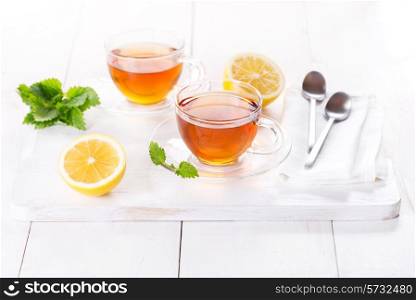 cups of tea with lemon and mint