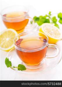 cups of tea with lemon and mint