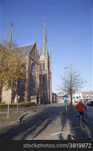 curch and bicycle on street of Woerden in the Netherlands