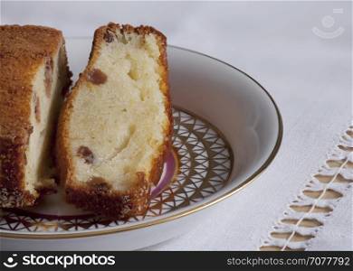 Curd cake with raisins brown crust on plate