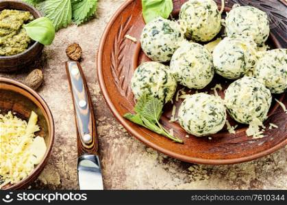 Curd dumplings or Malfatti with nettles, traditional Italian food. Nettle curd dumplings