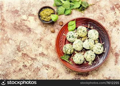 Curd dumplings or Malfatti with nettles, traditional Italian food.Space for text. Nettle curd dumplings