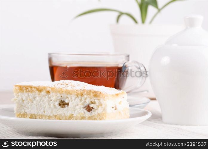 Curds shortbread with tea and sugar bowl on the table