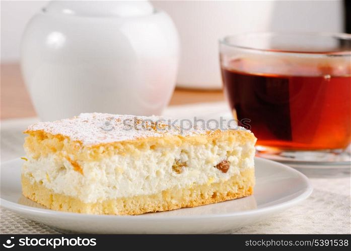 Curds shortbread with tea and sugar bowl on the table