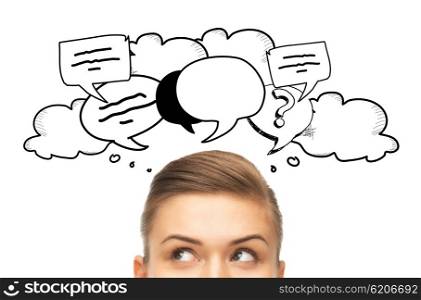 curiosity, communication and people concept - happy young woman or teenage girl face with text clouds