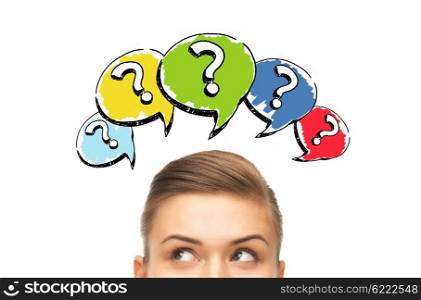 curiosity, information, knowledge, education and people concept - happy young woman or teenage girl head with question marks