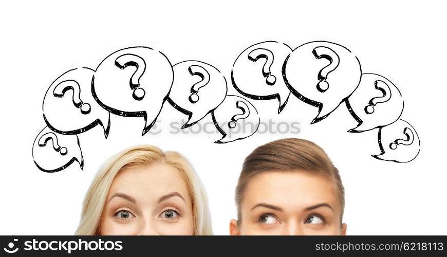 curiosity, information, knowledge, education and people concept - happy young women or teenage girl faces with question marks
