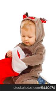 Curious cute baby examines Christmas sock&#xA;
