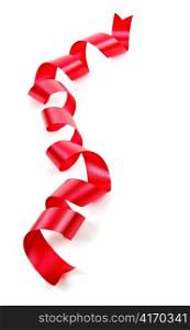 Curled red holiday ribbon strip isolated on white background