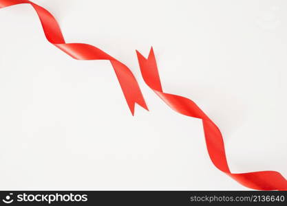 curled red ribbons white background