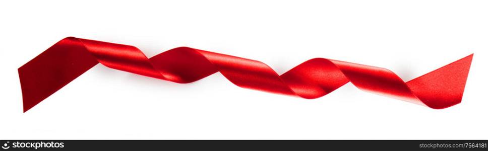 Curled spiral red ribbon tape isolated on white background. Red ribbon tape isolated on white