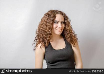 curly hair brunette on white background weared black shirt positive girl joy happyness concept