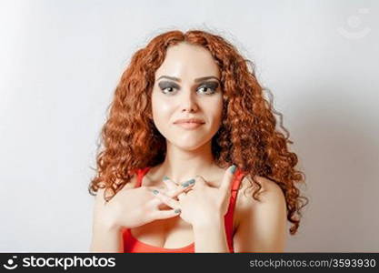 curly hair brunette on white background weared orange red shirt positive girl joy happyness concept