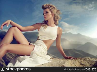 Curly haired lady sitting on the rock