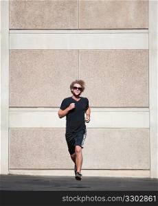 Curly haired man runs for exercise.