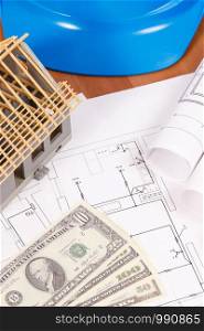 Currencies dollar, electrical drawings or diagrams, accessories for use in engineer jobs and house under construction, building home cost concept. Currencies dollar, electrical drawings, accessories for engineer jobs and house under construction, building home cost concept