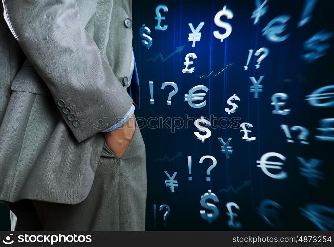 Currency concept. Bottom view of businessman and currency signs at background